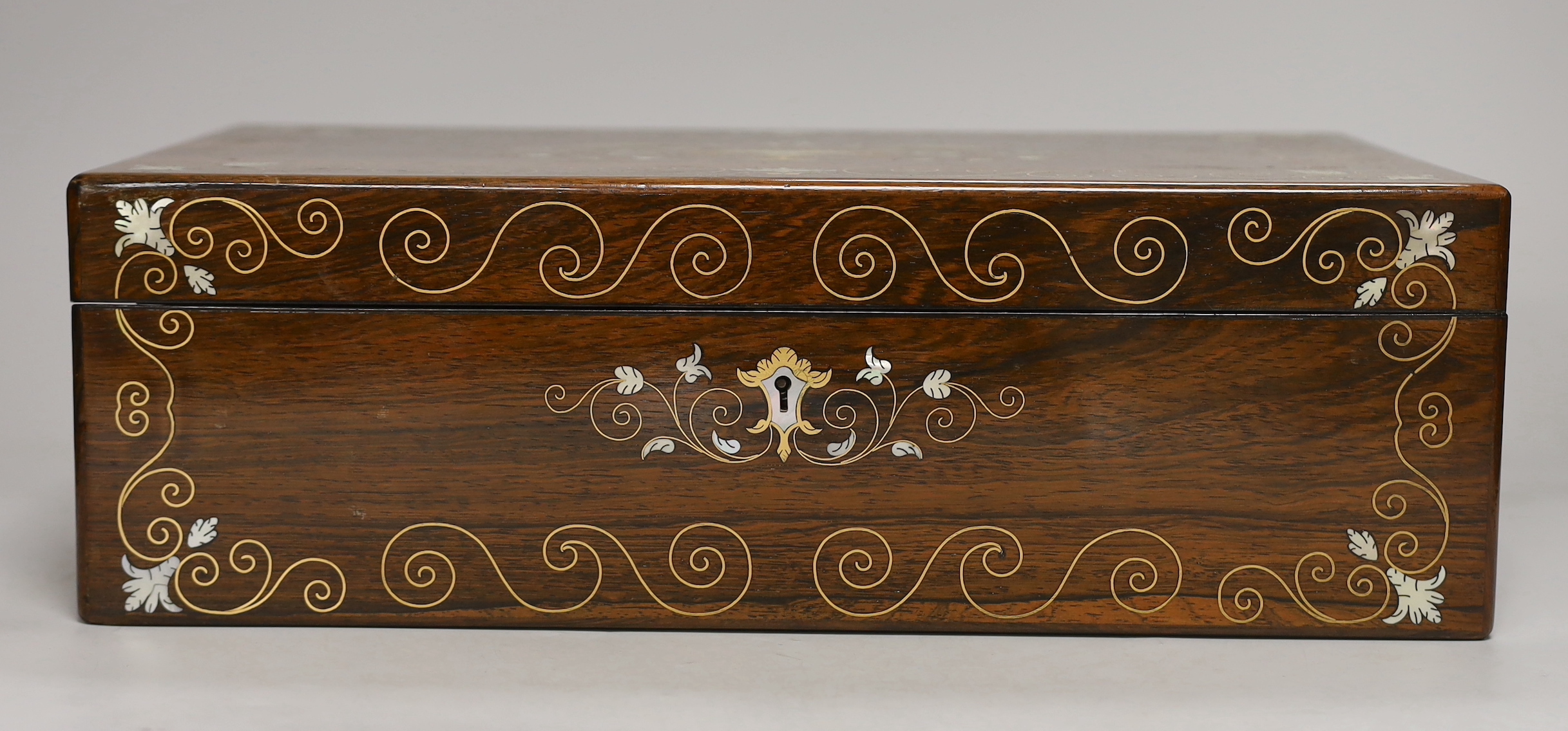 A 19th century brass and mother of pearl inlaid rosewood writing slope, 40cm wide